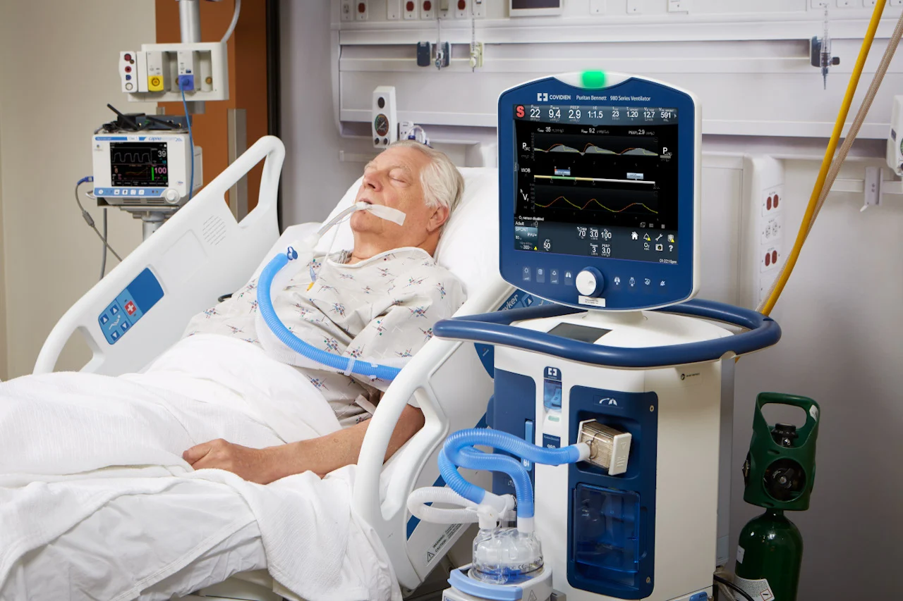 Patient on a ventilator, illustrating communication challenges.