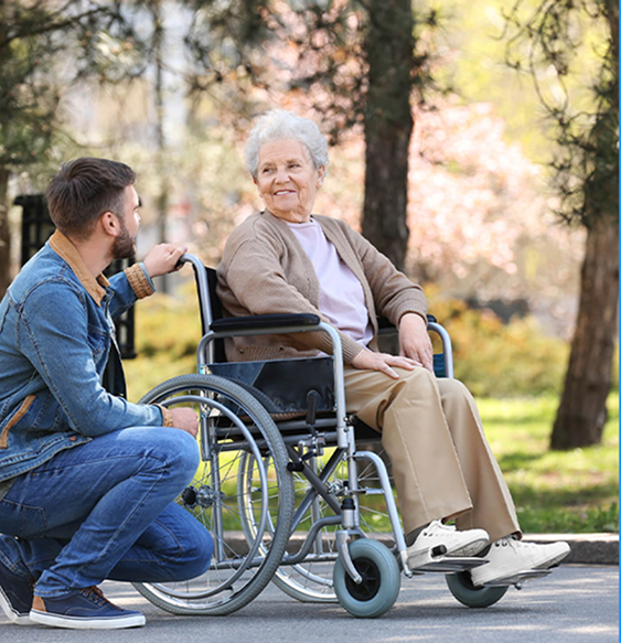 Registered nurse conducting a home health care consultation in Seattle with an elderly patient and caregiver at home
